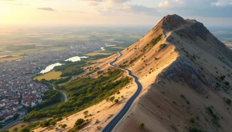 Une route sinueuse traverse un paysage idyllique, reliant une ville à la nature environnante.